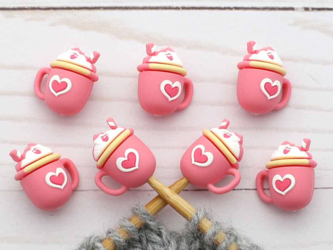 Strawberry milkshake stitch stoppers on knitting needles