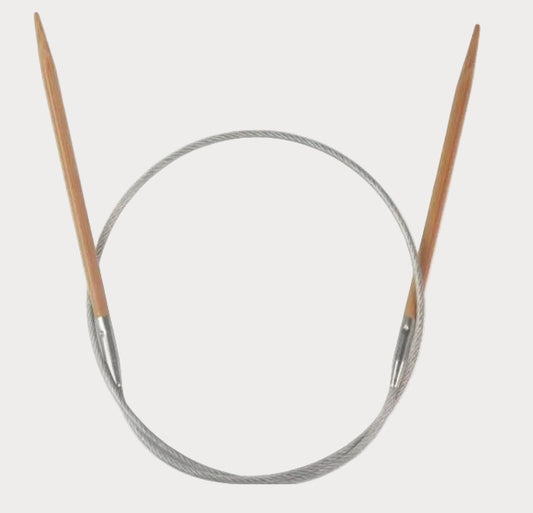 Knitting needles with wooden tips and metal circular base on a white background