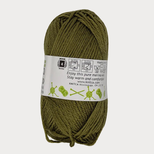 Ball of green yarn with a label on a light gray background