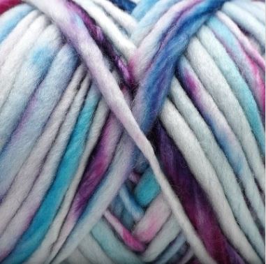 Close-up of variegated mohair yarn with blended pastel shades of blue, purple, pink, and white.