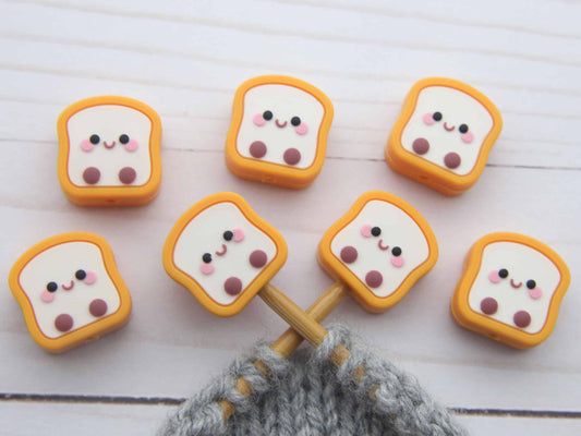 Toast stitch stoppers on knitting needles