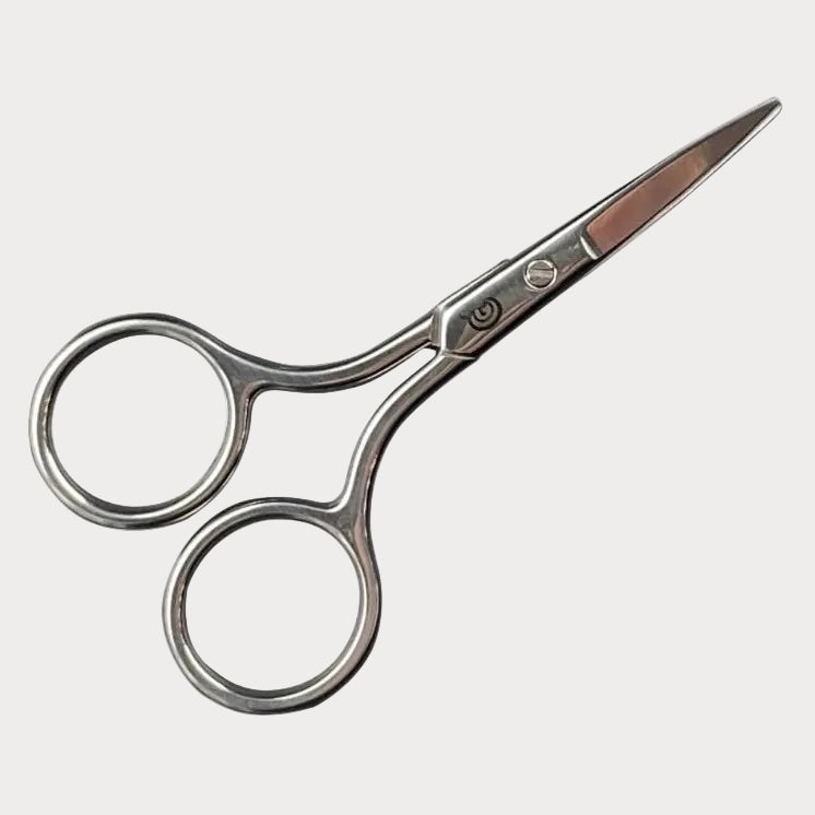 Pair of silver scissors on a white background