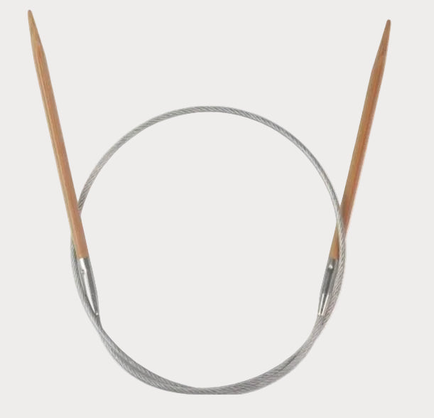 Knitting needles with wooden tips and metal circular base on a white background