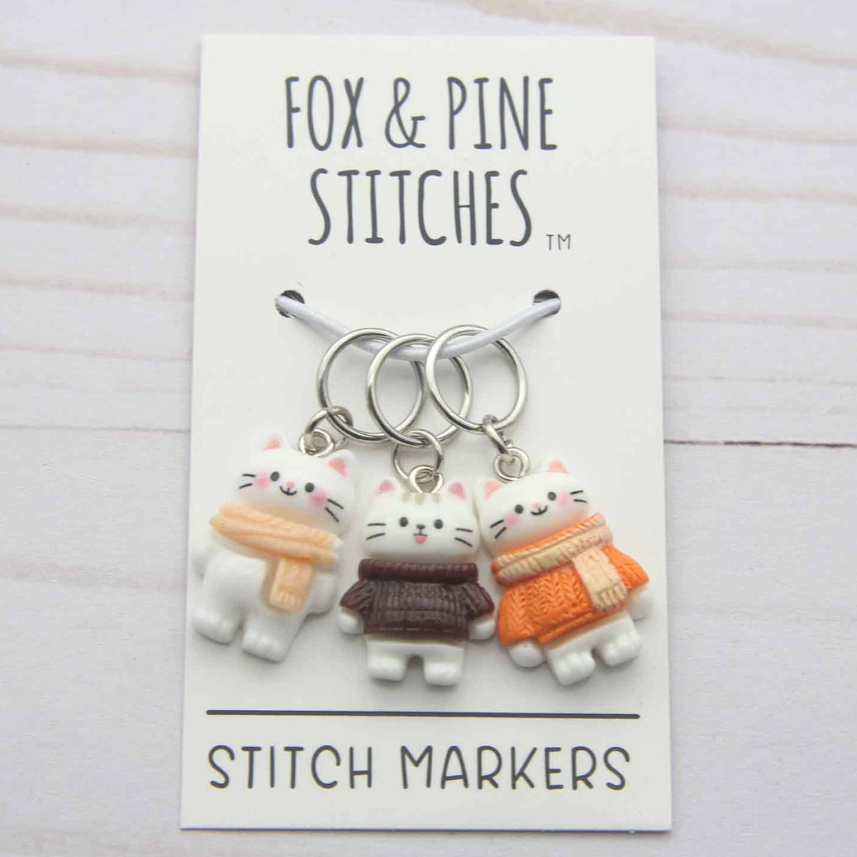 Set of stitch markers with cat designs on a 'Fox & Pine Stitches' card.