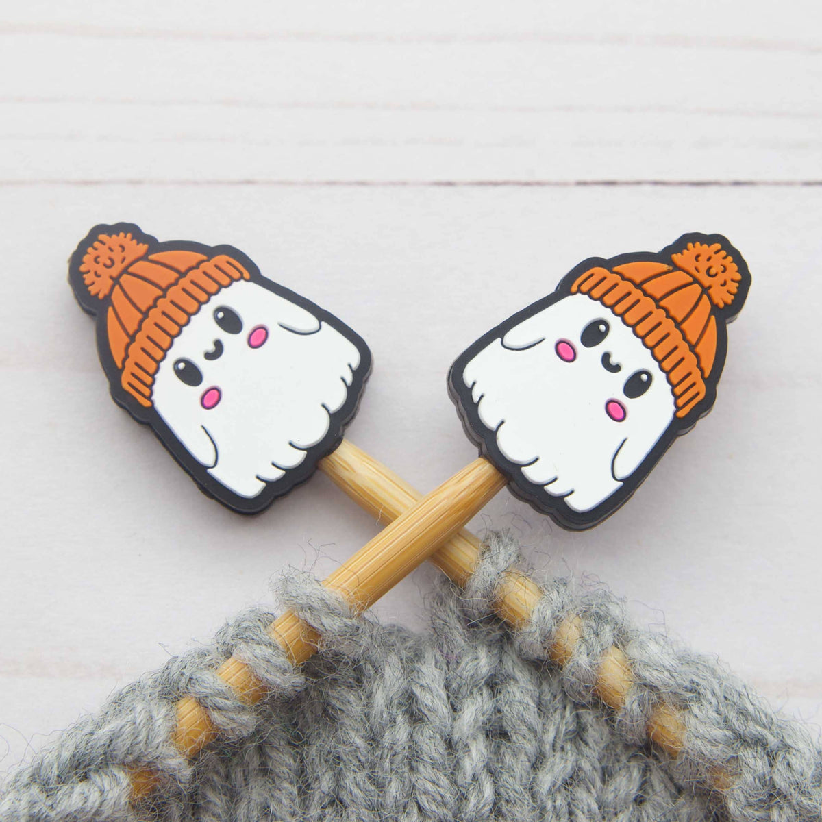 Cute Ghost stitch stoppers on knitting needles