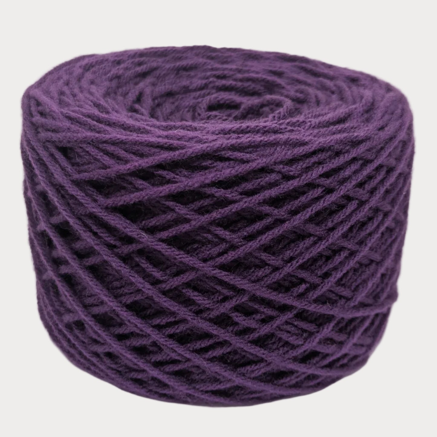 Purple yarn ball on a white background