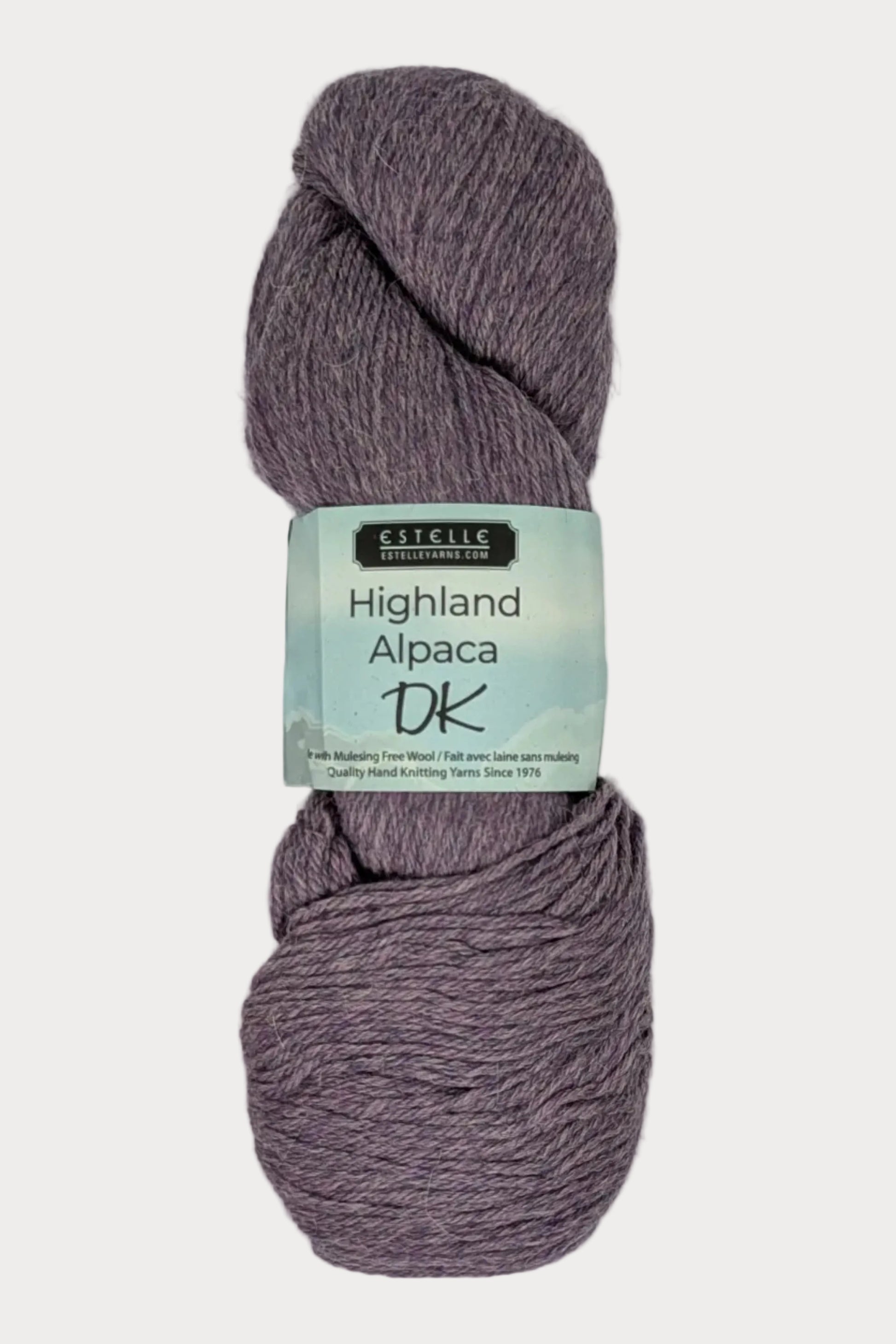 Purple skein of yarn with a label on a white background