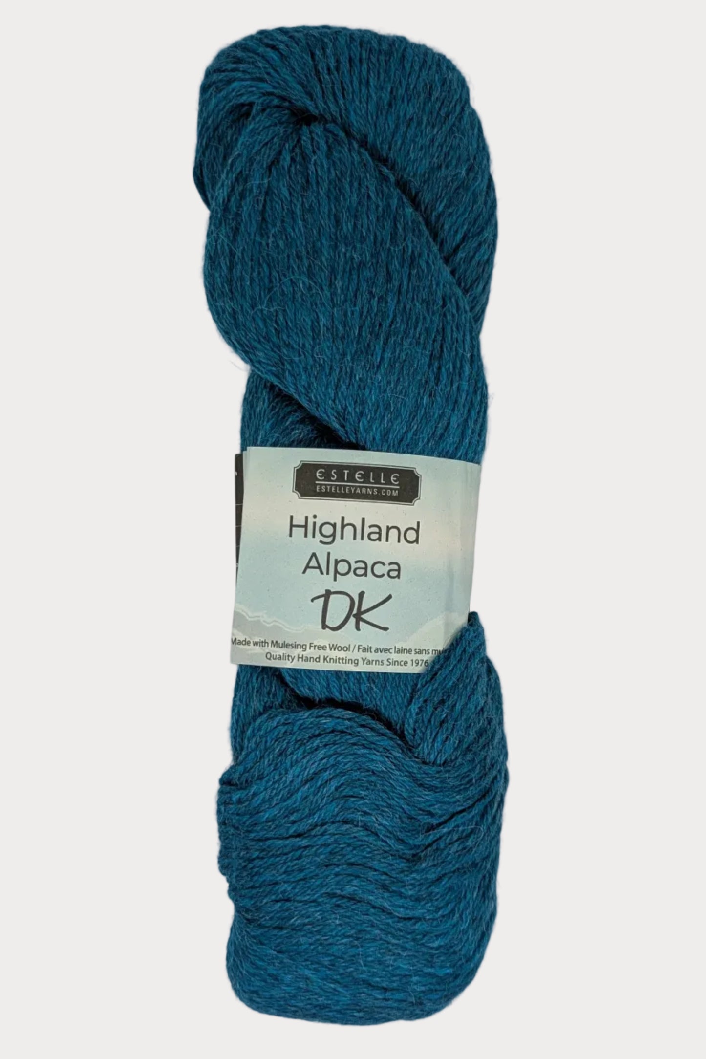 Blue skein of yarn with a label on a white background