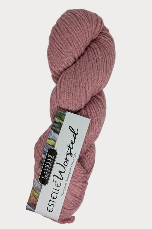 Pink skein of yarn with a label on a white background