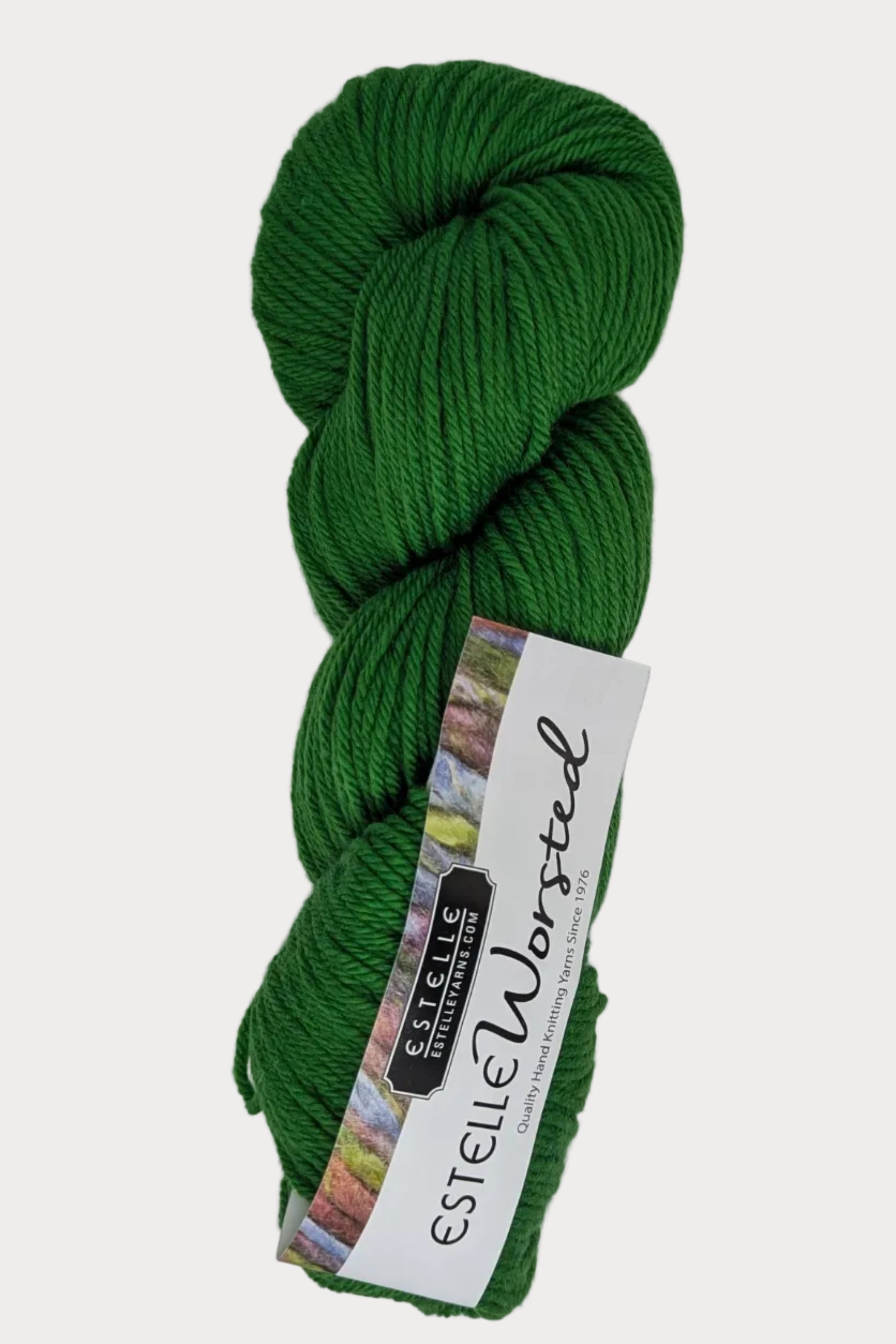 Green skein of yarn with a label on a white background
