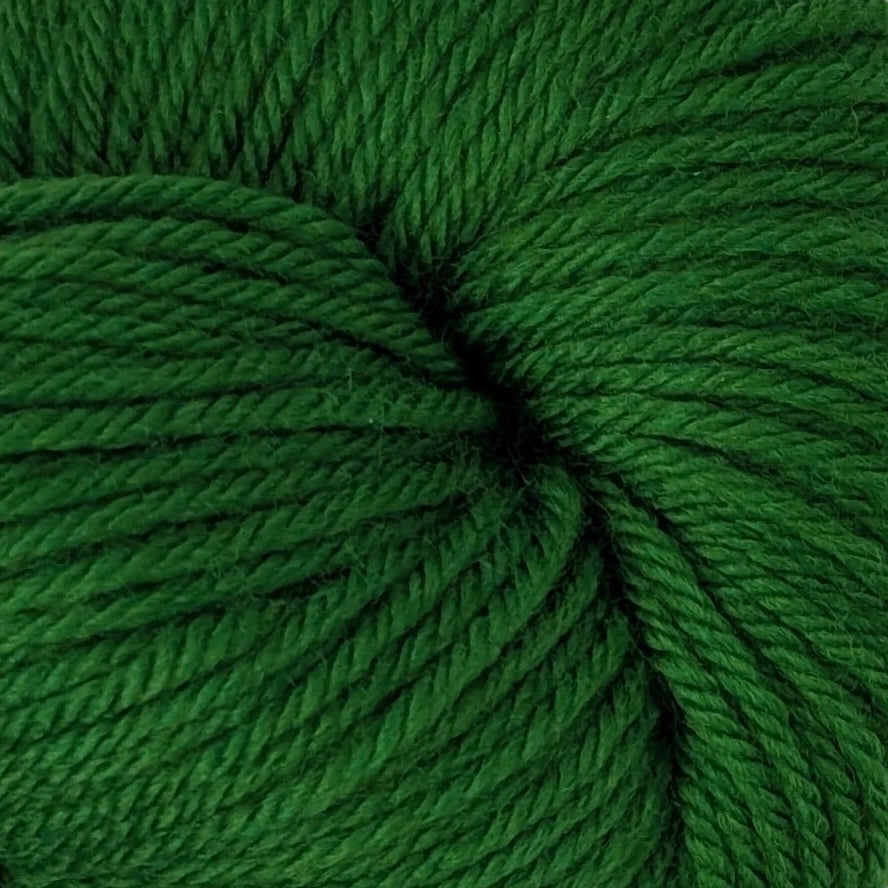 Green skein of yarn on a white background