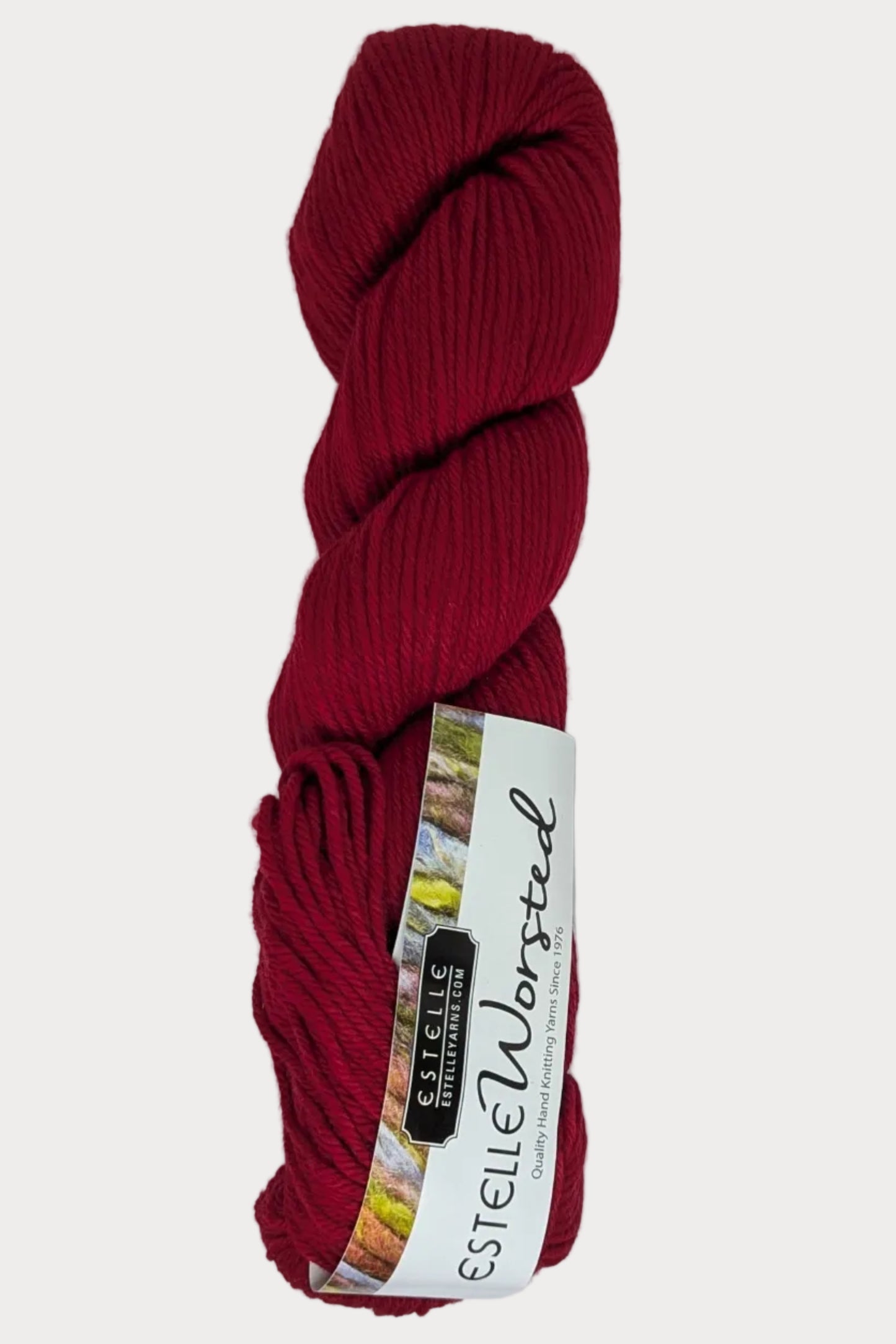 Red skein of yarn with a label on a white background