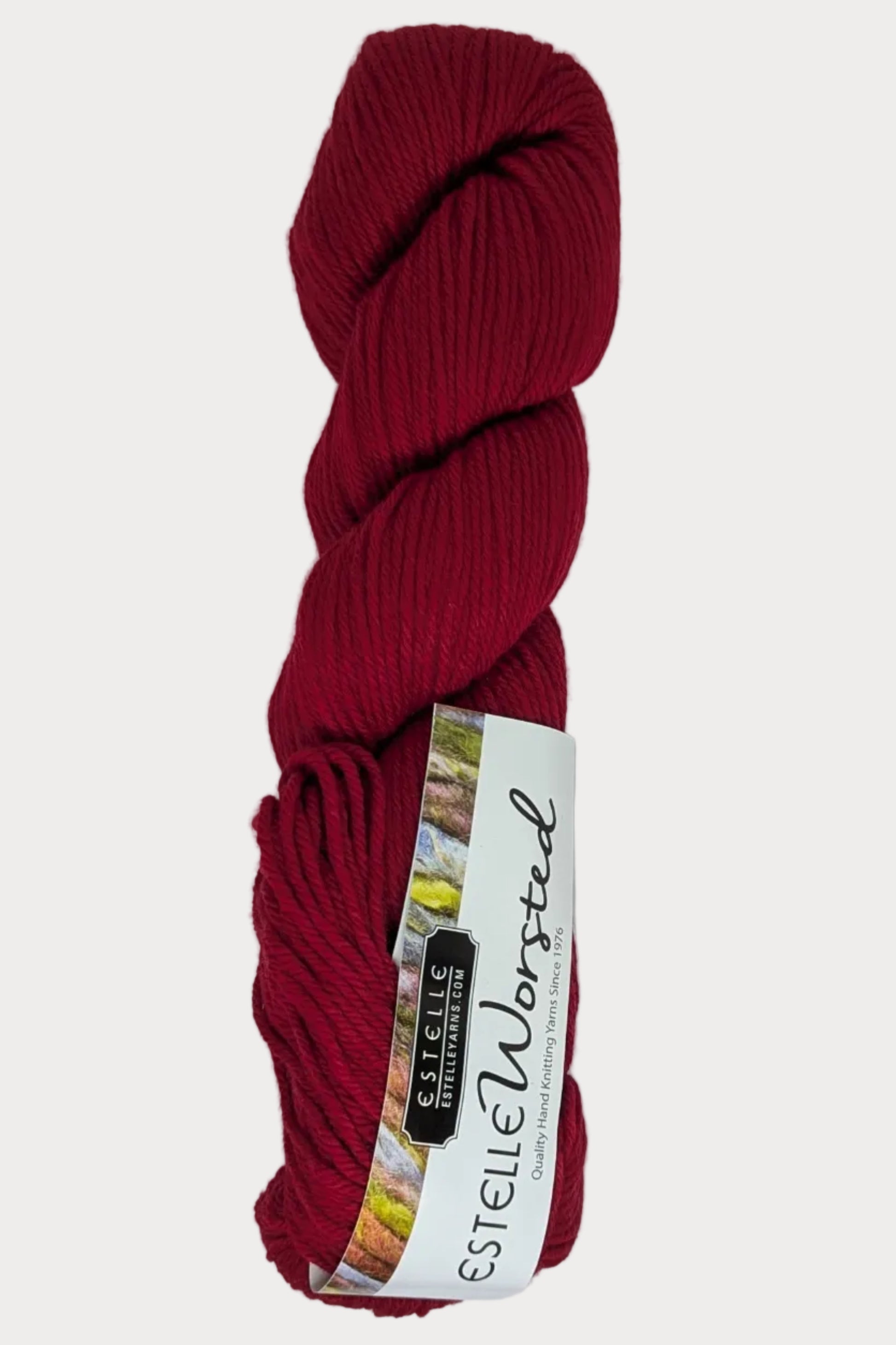 Red skein of yarn with a label on a white background