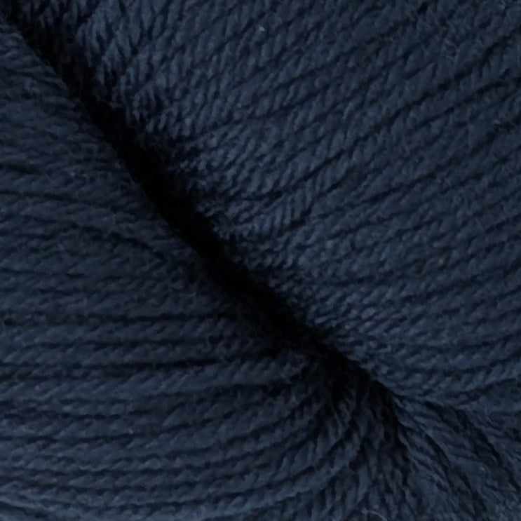 Dark blue skein of yarn on a white background
