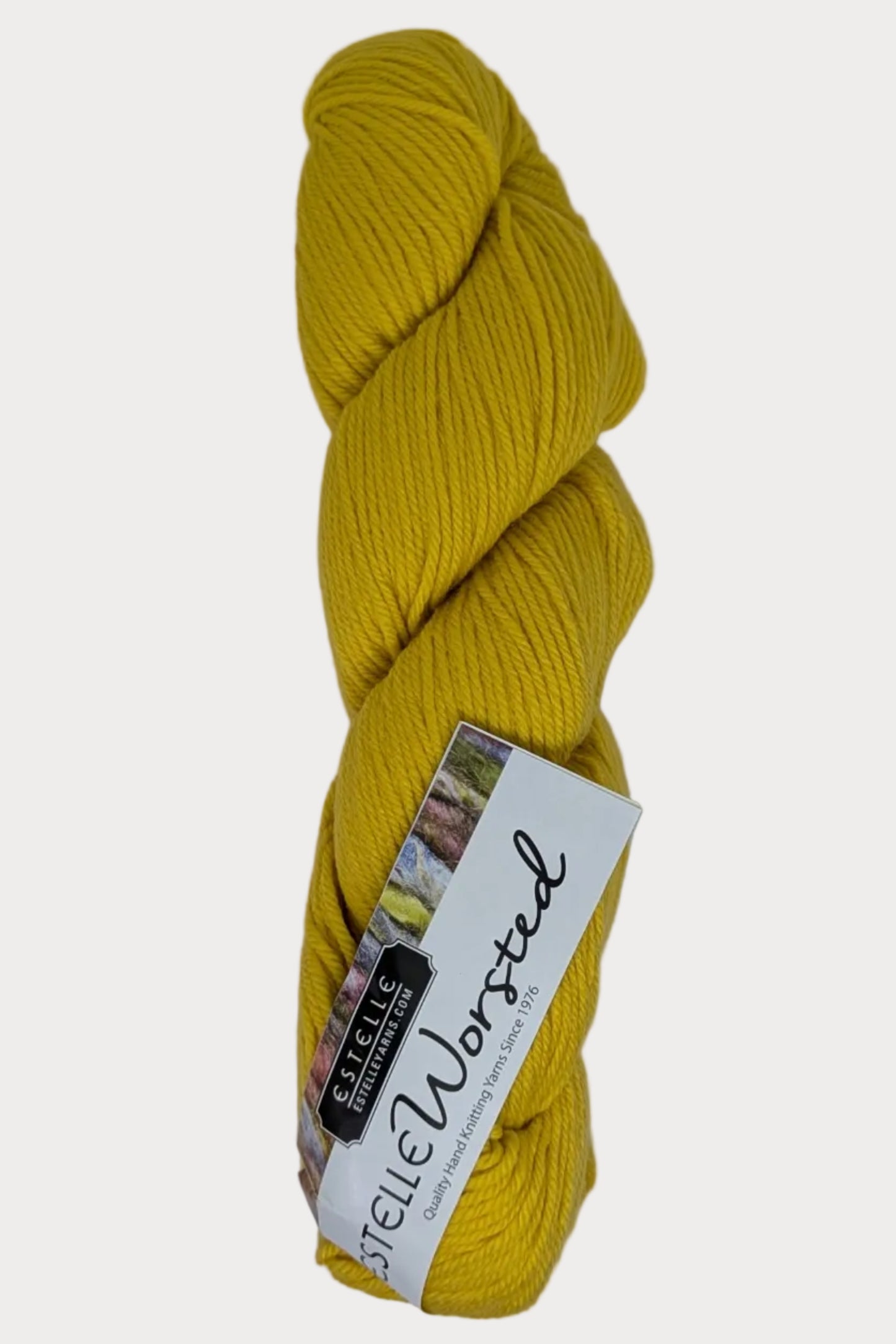 Yellow skein of yarn with a label on a white background