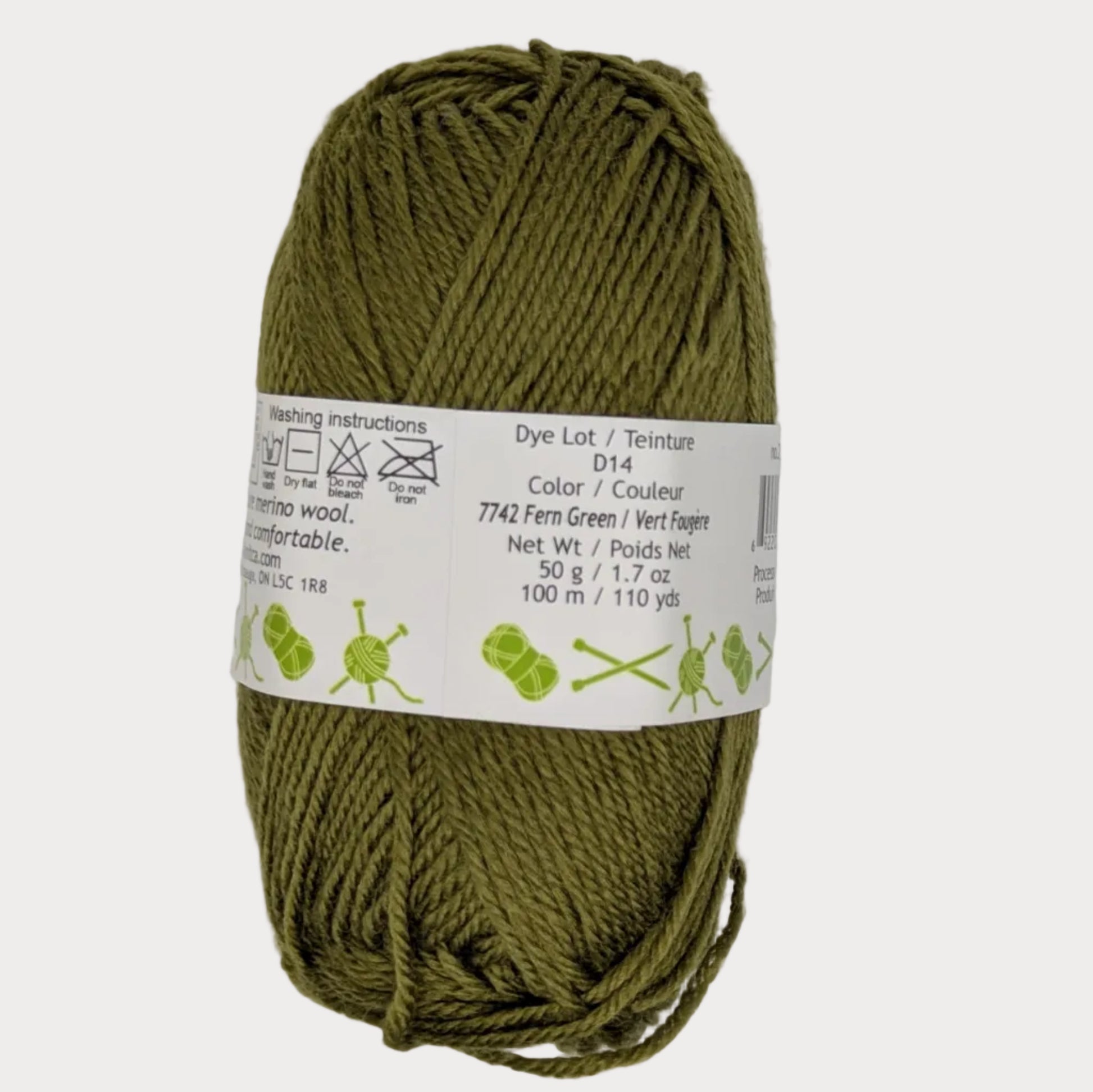 Ball of green yarn with a label on a light gray background
