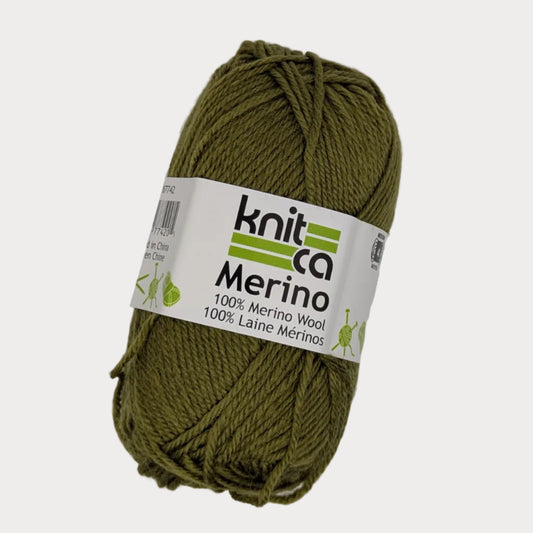 Ball of green yarn with a 'Knit Co Merino' label on a light gray background