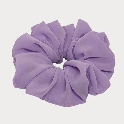 Purple scrunchie on a white background