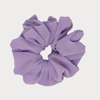 Purple scrunchie on a white background