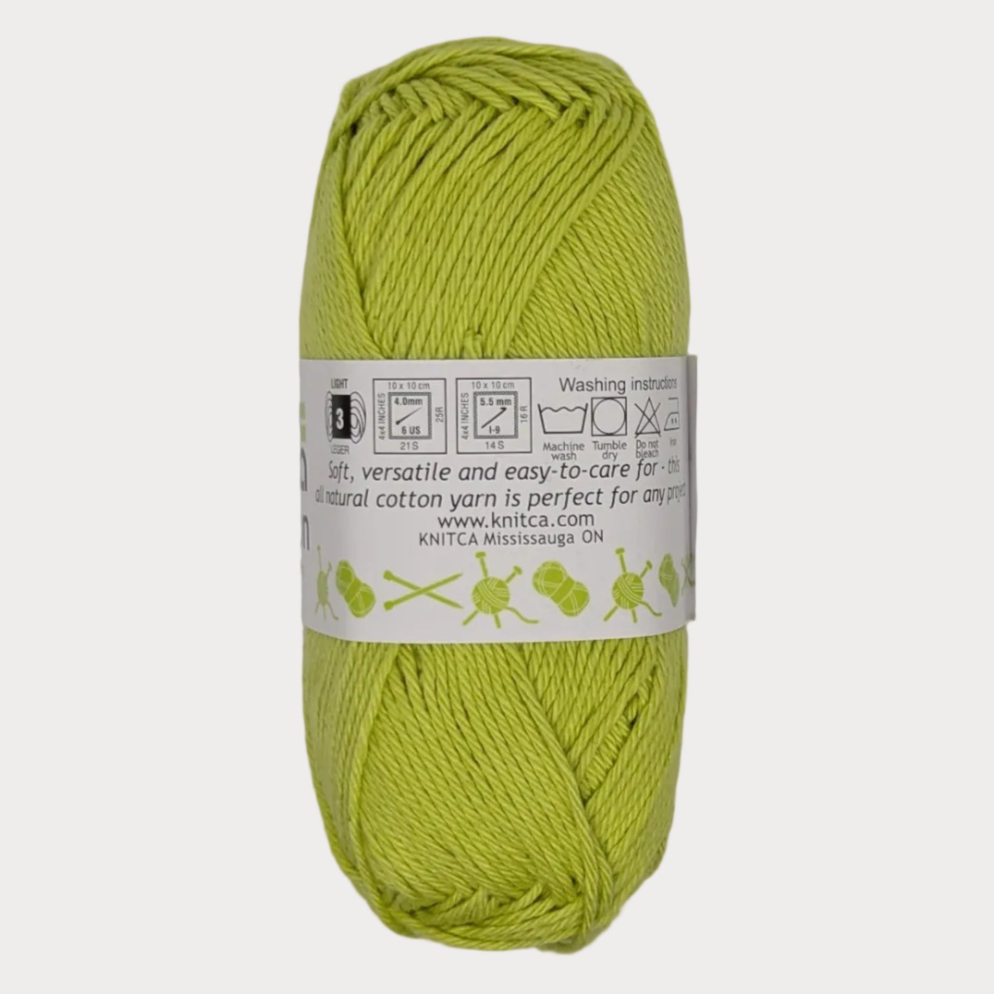 Lime green skein of yarn with a label on a light gray background