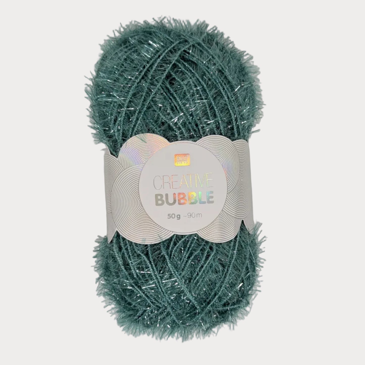 Green yarn ball with a label on a light gray background