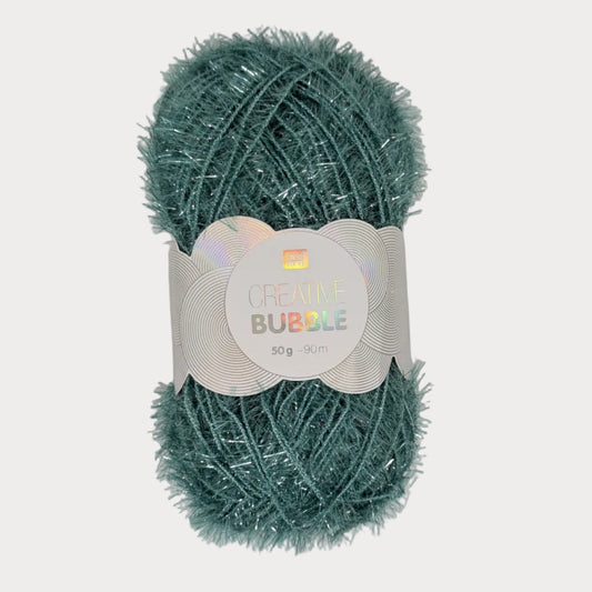 Green yarn ball with a label on a light gray background