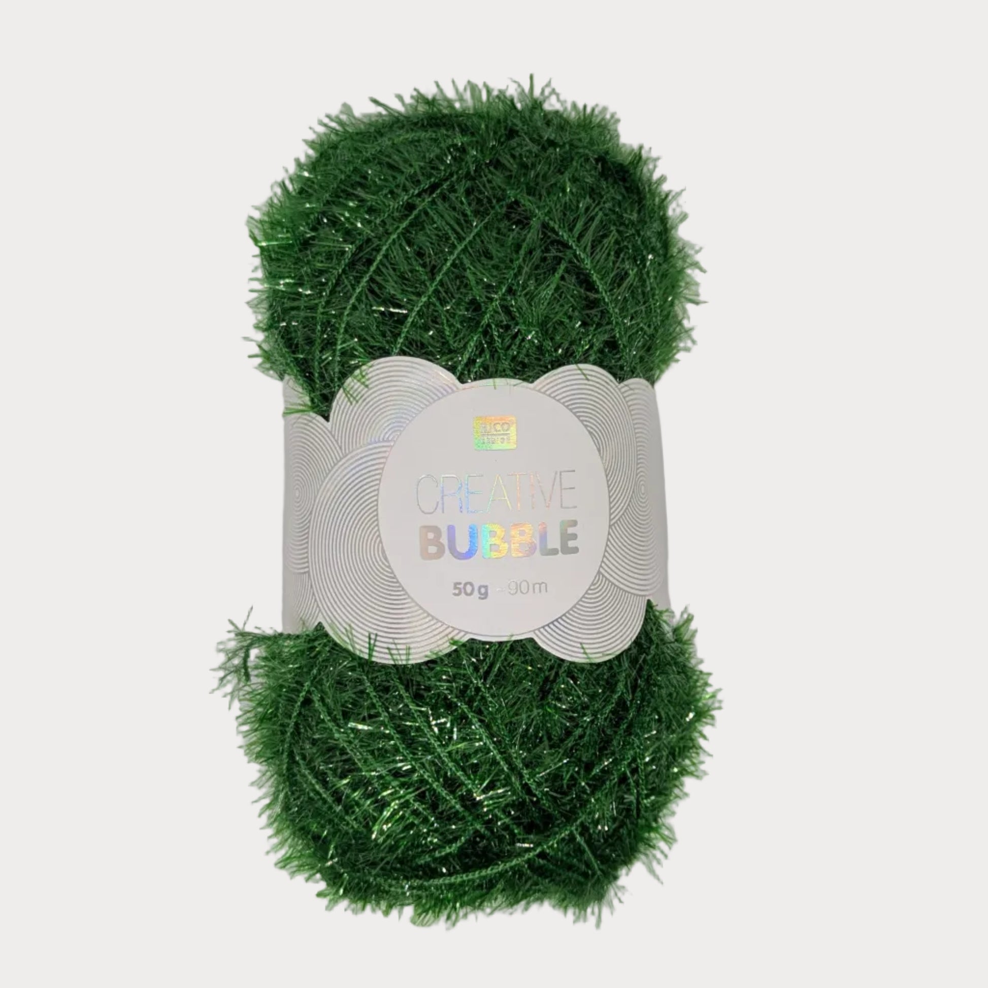 Green yarn ball with a label on a gray background