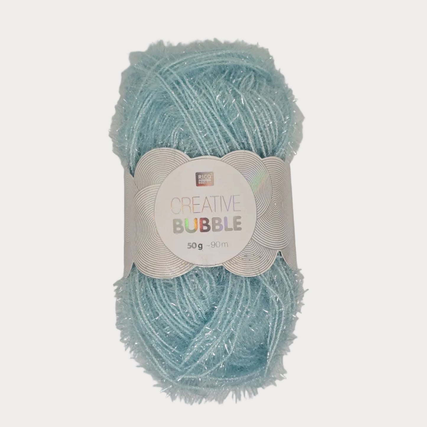 Ice Blue yarn ball with 'Creative Bubble' label on a light gray background