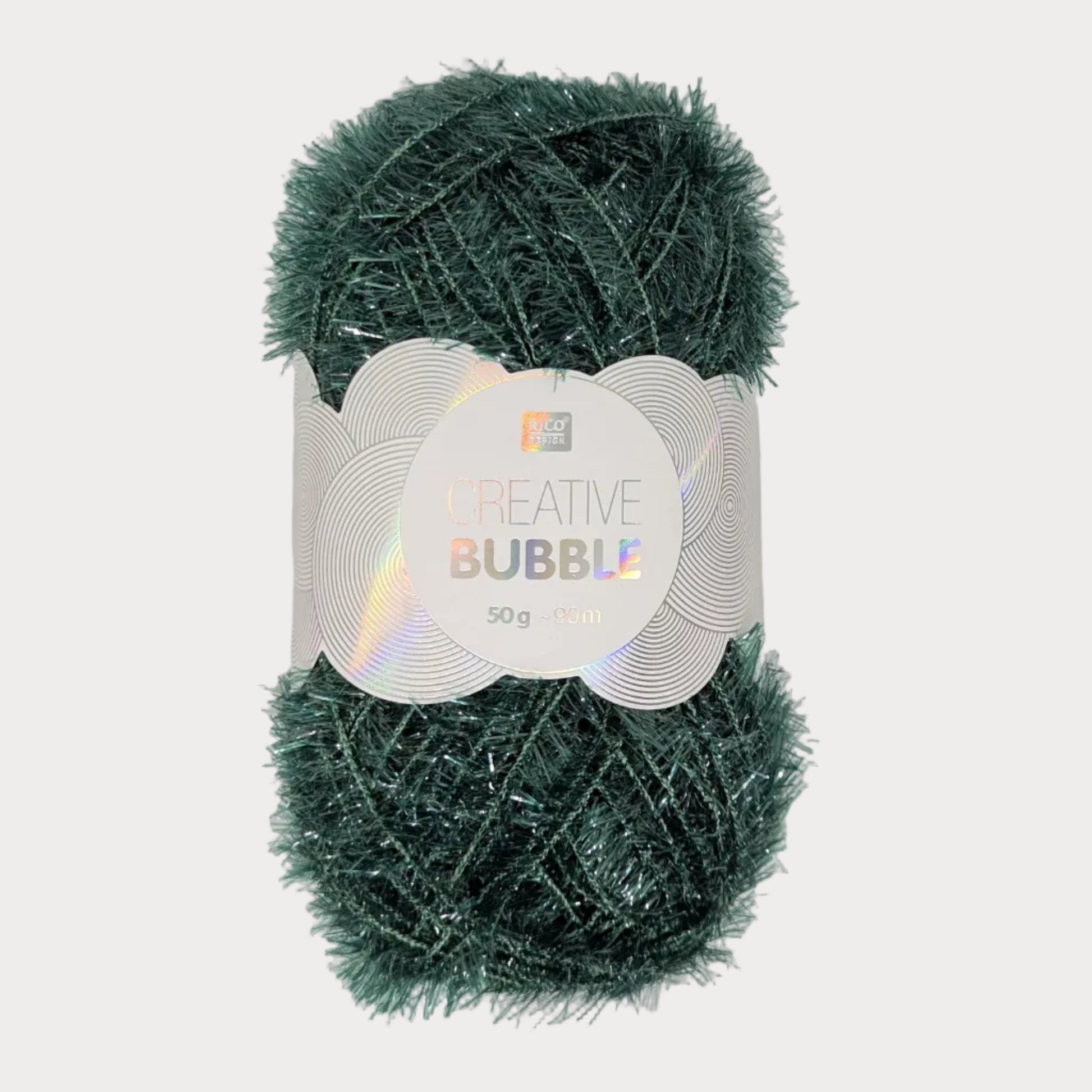 Green yarn ball with a label on a light gray background