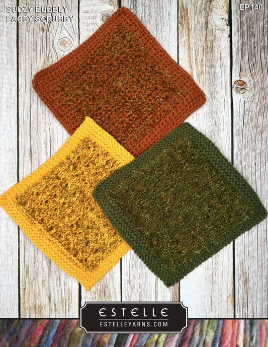 Three knit squares in brown, yellow, and green on a wooden surface with Estelle branding.