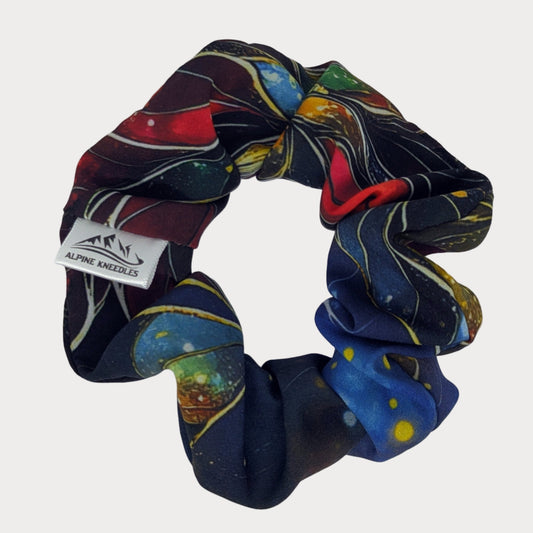 Colorful scrunchie with a brand label on a white background