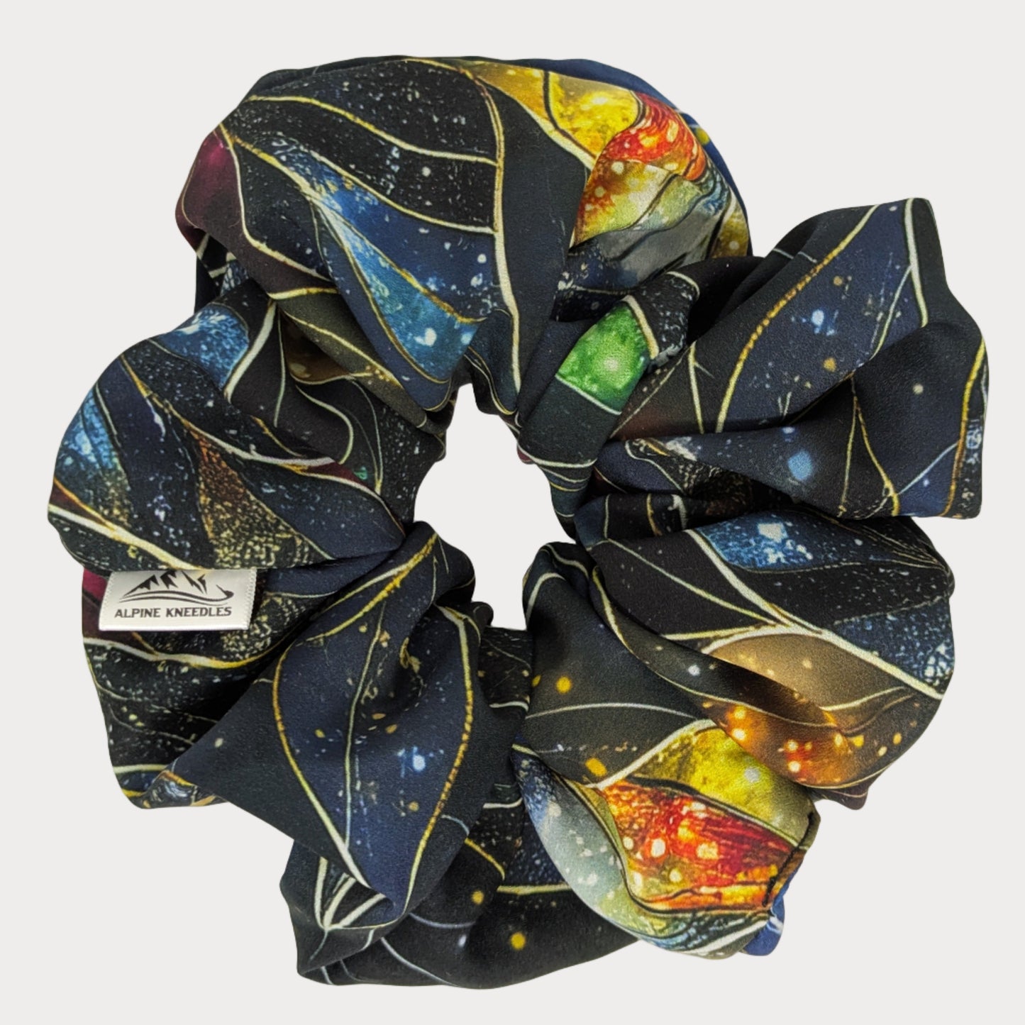 Scrunchie with space-themed design on a white background