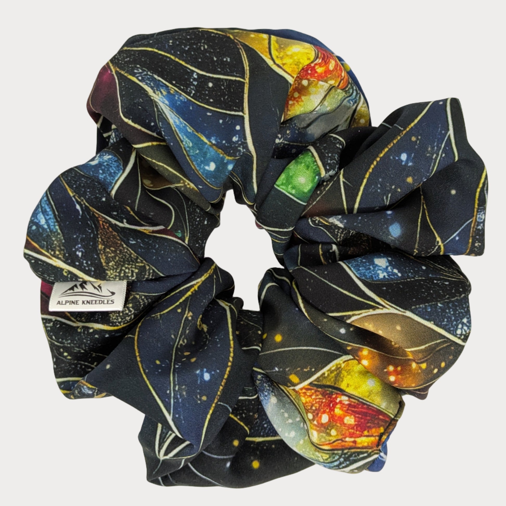 Scrunchie with space-themed design on a white background