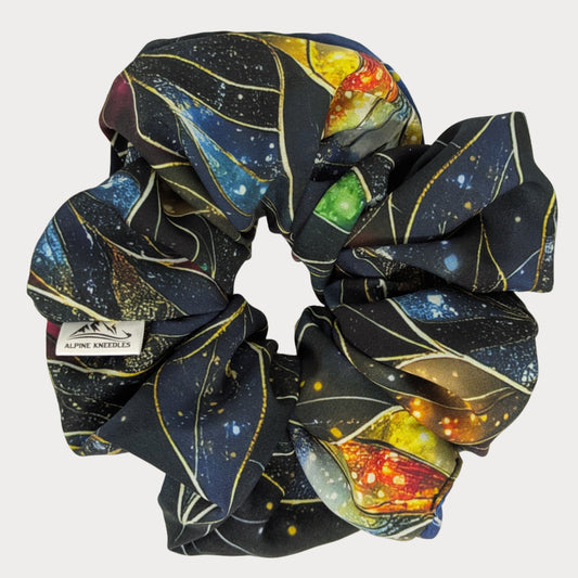 Scrunchie with space-themed design on a white background