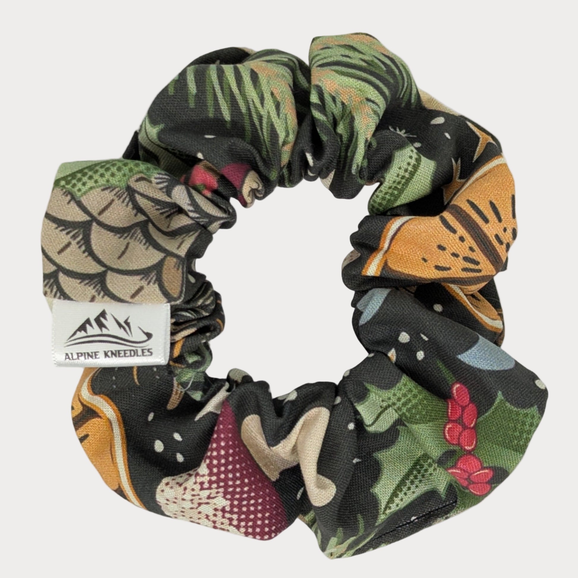 Multicolored scrunchie with a label on a white background