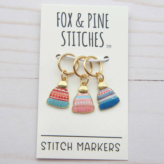 Three colorful stitch markers on a card with 'Fox & Pine Stitches' branding.